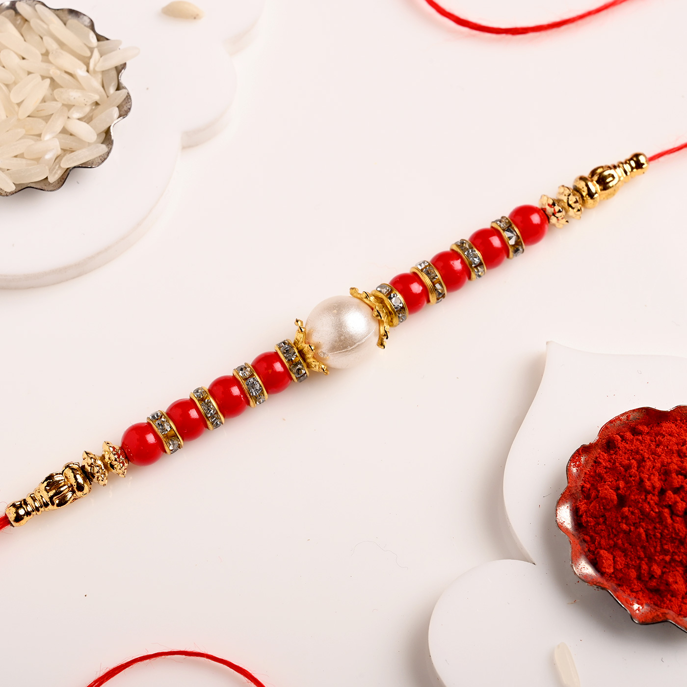 Red and White Pearl Rakhi - 12 Pcs - Image 2